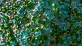 Closeup of green and blue seed beads. Royalty Free Stock Photo