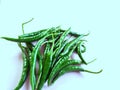 Closeup of green chili, white background.