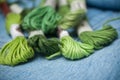 green cotton threads on blue jeans  background Royalty Free Stock Photo