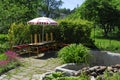 Green decorated garden with parasol