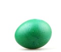 Closeup of a green-painted egg for Easter under the lights isolated on a white background Royalty Free Stock Photo