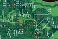 Closeup of green printed computer circuit boards. Top view.