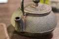 Closeup of green tea pot in table Royalty Free Stock Photo