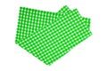 Closeup of a green and white checkered napkin or tablecloth isolated on white background. Kitchen accessories Royalty Free Stock Photo