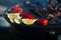 Closeup of grilled lemons, peppers and meat