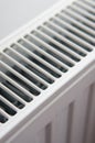 Closeup of the grills of a white radiator