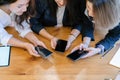 Closeup group of asian students hands sharing content on social media network with smartphone. Technology concept Royalty Free Stock Photo