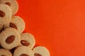 Delicious Almond cookies on orange background. Top view.