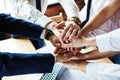 Closeup of a group of businesspeople joining their hands together. Royalty Free Stock Photo