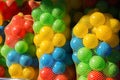 Closeup of a group of colorful plastic balls packed in net bags sold at a shop