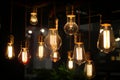 closeup on group of different Vintage Edison Light Bulb types illuminated in a dark environment,Generative AI