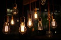 closeup on group of different Vintage Edison Light Bulb types illuminated in a dark environment,Generative AI