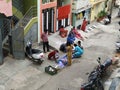 Closeup of Group of Indian Ladies purchasing hair pin, nail polish, and other ladies beauty accessories in roadside residential