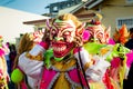 Closeup group of men in scary clowns costumes pose for photo at dominican carnival