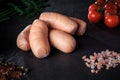 closeup group of short sausages with onion, dill, tomatoes Royalty Free Stock Photo