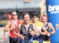 Closeup of group of running men in bright sunlight Royalty Free Stock Photo