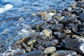 Closeup group of wet polished stones and pebbles were surfed by the sea Royalty Free Stock Photo