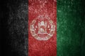 Closeup of grunge Afghan flag. Dirty Afghanistan flag on a metal surface Royalty Free Stock Photo