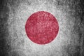Closeup of grunge Japanese flag. Dirty Japan flag on a metal surface Royalty Free Stock Photo