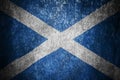 Closeup of grunge Scottish flag. Dirty Scotland flag on a metal surface Royalty Free Stock Photo