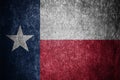 Closeup of grunge Texas flag. Dirty Texas flag on a metal surface