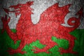 Closeup of grunge Welsh flag. Dirty Wales flag on a metal surface Royalty Free Stock Photo