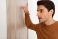 Closeup of guy knocking on the wooden door Royalty Free Stock Photo