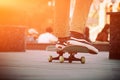 A closeup of a guy is riding a skateboard in the city. Royalty Free Stock Photo