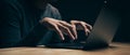 Closeup of hacker is using the laptop computer to coding virus or malware for hacking internet server, Cyber attack, System Royalty Free Stock Photo