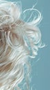 Closeup of hair with cloudlike softness capturing the texture and lightness against a skyblue background