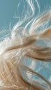 Closeup of hair with cloudlike softness capturing the texture and lightness against a skyblue background