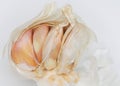 Closeup of half of a bulb of garlic revealing the cloves