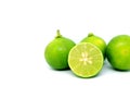 Half cut fresh lime with whole fruits isolated on white background Royalty Free Stock Photo