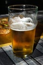Closeup of half-filled glass of beer Royalty Free Stock Photo