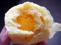 Closeup half inside of salted egg yolk custard lava bun Royalty Free Stock Photo