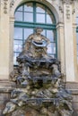 Closeup half naked faunus statues fountain at Zwinger palace in