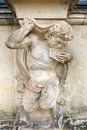 Closeup half naked satyr statue playing panpipe at Zwinger palace Royalty Free Stock Photo