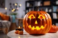 Closeup of Halloween pumpkin, casting an eerie glow in living room