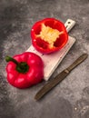 Halved red bell pepper on a cutting board