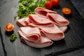 Closeup ham slices, over dark background Royalty Free Stock Photo