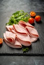 Closeup ham slices, over dark background Royalty Free Stock Photo