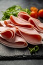 Closeup ham slices, over dark background Royalty Free Stock Photo