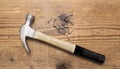 Closeup of a hammer and a pile of rivets, nails on white background Royalty Free Stock Photo