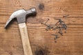 Closeup of a hammer and a pile of rivets, nails on white background Royalty Free Stock Photo