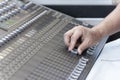 Closeup of hand adjust the professional audio digital mixing console. Royalty Free Stock Photo