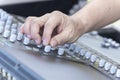 Closeup of hand adjust the professional audio digital mixing console. Royalty Free Stock Photo