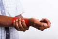 Black man holds his wrist hand injury, feeling pain Royalty Free Stock Photo