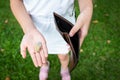 Closeup hand of asian child girl shows her wallet,hand open an empty wallet, spend money extravagantly,extravagant people never Royalty Free Stock Photo