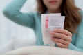 Closeup hand asian woman sitting on sofa worried with bills about financial and stress at home. Royalty Free Stock Photo