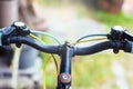 Closeup hand brake mountain bike handle caliper bicycle blurred tree background for Exercise for health image